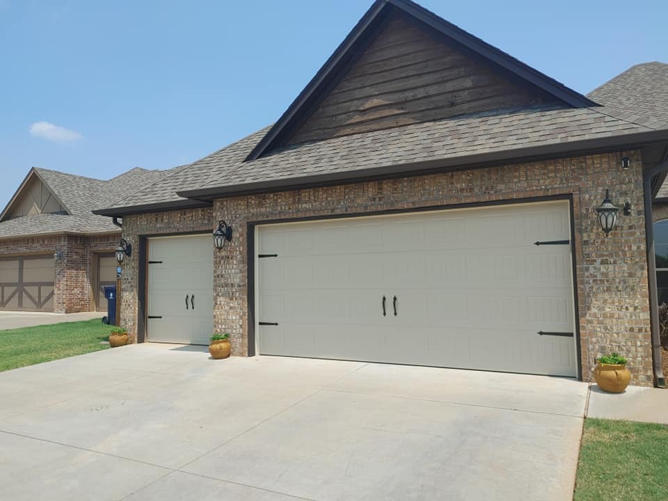 Reviews for Total Door Solutions in Oklahoma- image of a house with a new garage door install