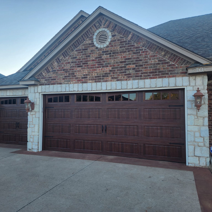 about Total Door Solutions in Oklahoma - new garage door install by total door solutions in oklahoma. wood panels for the garage door.