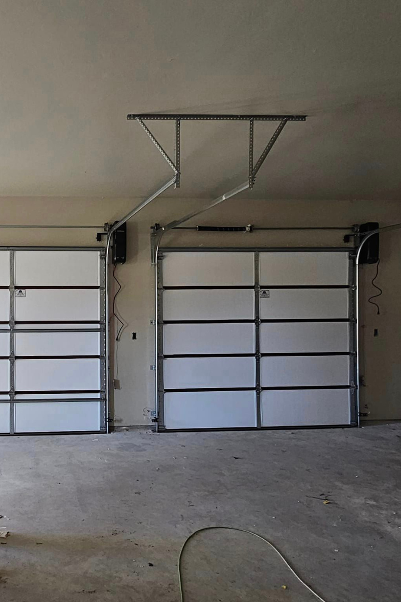 5 signs to replace your garage door in oklahoma - total door solutions - image of a new garage door installed from the back view (inside of the garage looking at the back of the paneling)