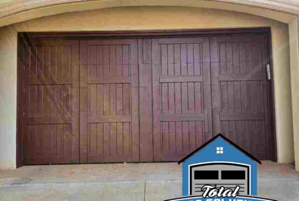 image of a new garage door installed by Total Door Solutions in Oklahoma City. Logo of Total Door Solutions in bottom right corner