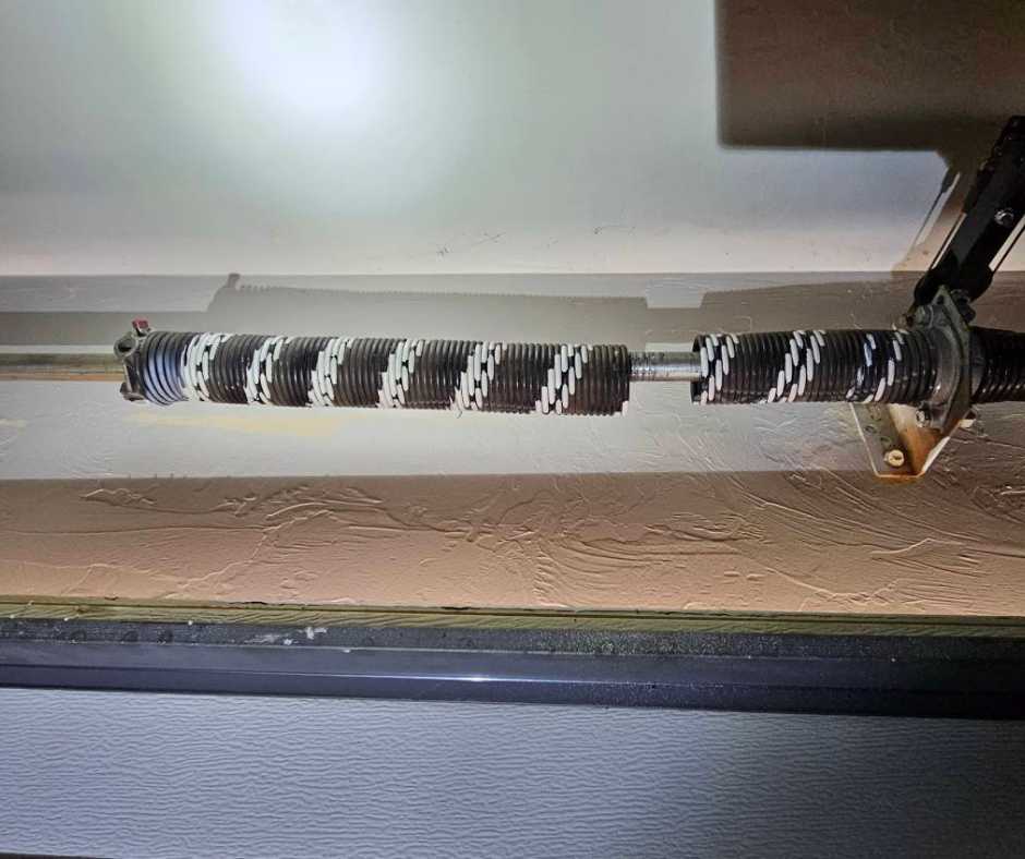 garage door off track due to broken spring